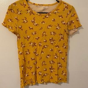 Yellow waffle top with red and white flowers